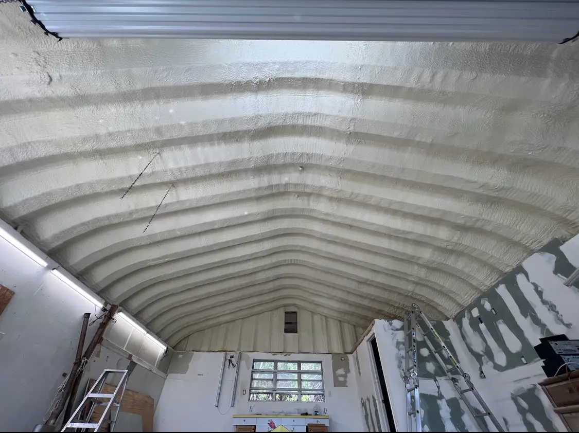 Spray polyurethane foam applied to the underside of a metal roof deck in Lexington